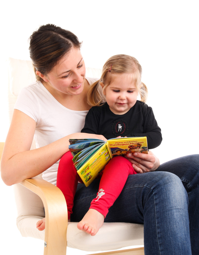 Therapist reading to child.